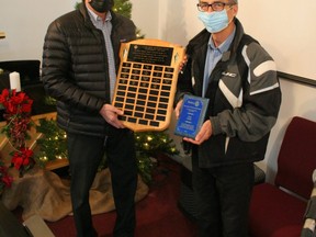 This year Rotary co-president Chris Laue (left) presented the Integrity Shield to Pastor Dave Brisbin of the Fairview Gospel Chapel (right).