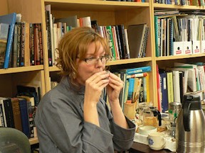 •	Photograph from the Peace River Museum, Archives and Mackenzie Centre, May 14, 2011, Afternoon of Chinese Tea. Hostess Wend Wagner of ZenSpa demonstrates the proper way to sip tea, whether it be from China, Japan, or Korea. The afternoon tea was in conjunction with the Royal Alberta Museum travelling exhibit: Chop Suey on the Prairies – A Reflection of Chinese Restaurants in Alberta.