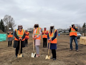 From left to right, front, Nancy Simmonds, Heartland Housing Foundation CEO; Ann Marie LePan, Executive Director of the Robin Hood Association; and Deanna Lennox, Heartland Housing Foundation Board Chair and Fort Saskatchewan City Councillor; back, family members of the late Muriel Ross Abdurahman; Fort Saskatchewan Mayor Gale Katchur; Brian Kelly, Heartland Housing Foundation Board Member and Fort Saskatchewan City Councillor, pose at the new affordable housing site in Fort Saskatchewan. Photo Supplied.