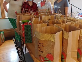 Drop-In at the Bridge cooked and delivered 81 Christmas dinners to local residents on the weekend of December 17. L-R: Jen Morin, Sue Crewson, Gabriele Hertweck, Jennifer Shields. SUBMITTED