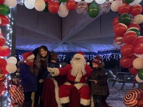 Visiting Santa Claus in Victoria Park at the Christmas Stay-cation parade on December 19 were Órlaith, Colleen, Connor and Cián Groome. Hannah MacLeod/Kincardine News