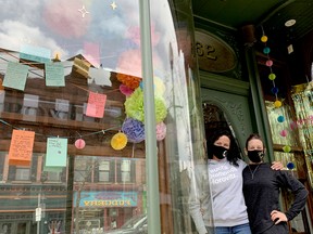 MESSAGES OF KINDNESS
Laura Phipps, left, and Joey Diotte, co-owners of Heather and Crow on King Street West, pose with some of the messages of kindness hung in their storefront on Thursday afternoon, Apr. 22, 2021. The women have been invited area residents to post kind messages to cheer people up during the pandemic. (RONALD ZAJAC/The Recorder and Times)