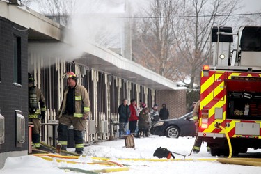 Firefighters respond to a fire in a room at The Canuck, 410 Pim St., on Thursday, Dec. 30, 2021. (BRIAN KELLY/THE SAULT STAR/POSTMEDIA NETWORK)