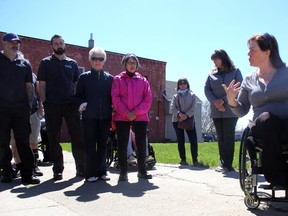 Nancie Scott speaks while leading a tour highlighting accessibility on Queen Street East during a Jane's Walk in Sault Ste. Marie, Ont., on Friday, May 5, 2017. (BRIAN KELLY/THE SAULT STAR/POSTMEDIA NETWORK)