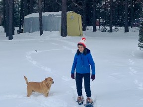 Armande Pieschke enjoys an afternoon snowshoe in her backyard and she is accompanied by the neighbour's dog Sarge.