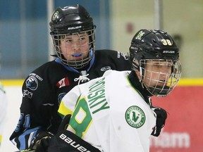 Kent Cobras' Luke Holmes, left, battles Mississauga North Stars' Sebastian Dubrovskiy during an under-14 AA pool game at the Chatham Regional Silver Stick Tournament at Thames Campus Arena in Chatham, Ont., on Saturday, Dec. 11, 2021. Mark Malone/Chatham Daily News