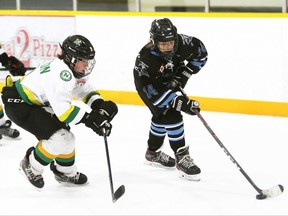 Kent Cobras' Brody Holmes, right, is chased by Mississauga North Stars' Mathieu Burleton during an under-14 AA pool game at the Chatham Regional Silver Stick Tournament at Thames Campus Arena in Chatham, Ont., on Saturday, Dec. 11, 2021. Mark Malone/Chatham Daily News
