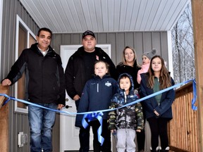 The Cameron family at their new Habitat home with Chief Lester Anoquot at Saugeen First Nation, Ont. on Nov. 29, 2021. (Photo supplied by Habitat for Humanity Grey Bruce)