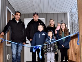 The Cameron family at their new Habitat home with Chief Lester Anoquot at Saugeen First Nation, Ont. on Nov. 29, 2021. (Photo supplied by Habitat for Humanity Grey Bruce)