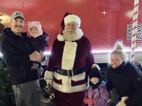 The Martin family - Bill holding Aubrey, Scarlett and mom Nicki - took a moment to pose for a Christmas photo with Santa Claus during the Mitchell BIA street party Dec. 3. SUBMITTED