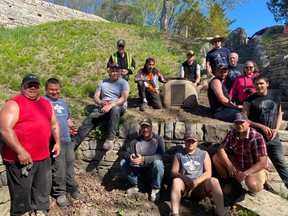 Many of the drystone wall workers rebuilding and upgrading the Saugeen First Nation Amphitheater, along with others, at an earlier stage of the project.  (Photo provided)