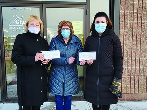 Linda Blumenthal (centre) of Second Glance Clothes presented Zdenka Turner (left) of the Leduc & District Food Bank and Alison Hagan of STARS with the store's 2021 community grants on Dec. 6. (Dillon Giancola)