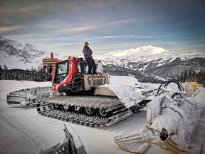 Bobby Lavery stands atop a snow cat that he operates at Banff Sunshine Village. photo by Bobby Lavery