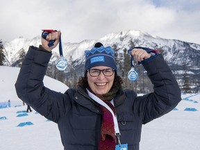Glass artist Nicole Tremblay holds up the awards she made for the winners at the World Para Nordic World Cup at the Canmore Nordic Centre from December 4-12, 2021.
photo by Pam Doyle/www.pamdoylephoto.com