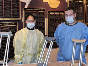 Gaganpreet Kaur and Josh Ivany, screening staff at Brantford General Hospital, help gather donations of crutches, which are in short supply. Submitted