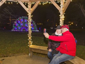 Shari and Rory Stubbs take a selfie in a gazebo at the Brantford Lights at Glenhyrst that lit up for the first time this season on Friday.