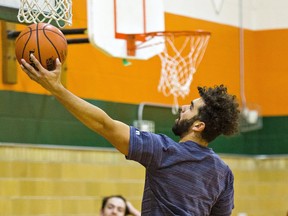 Tariq Hamed of North Park Collegiate's senior boys basketball team goes up a shot during a practice.