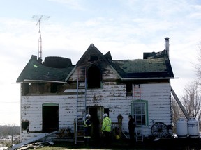 Officials investigate the scene of a tragic fire near Westport on Wednesday afternoon.