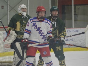 South Grenville's Zach White stands in front of the Metcalfe net with Jets goalie Griffin Thiesson and defenceman Tyler Allard during the first period of their NCJHL game in Cardinal Saturday night. The Jr. C Rangers trailed after two periods but scored five in the third to win 6-2.
Tim Ruhnke/The Recorder and Times