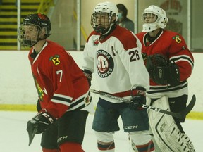 Ottawa captain Thomas Freel stands between Brockville defenceman Kevin Fitzgerald and goalie Brandon Abbott during the Braves' home-opener on Sept. 24. The league-leading Jr. Senators will be back at the Memorial Centre on Friday night for Brockville's final home game of 2021.
File photo/The Recorder and Times