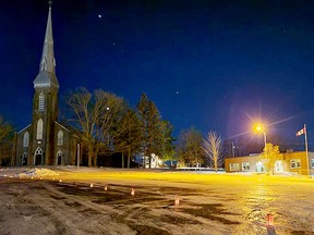 The street outside St. Edward the Confessor Catholic Church in Westport was lined with paper bag luminaries on Sunday night, as a tradition of pre-Christmas luminaries made a welcome return. (SUBMITTED PHOTO BY LAURA DEEVES)