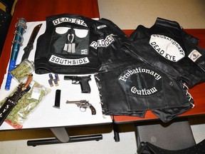 Items seized during a 2018 raid on local motorcycle gang members included weapons and drugs.
