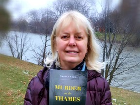 Chatham author Sheila Gibbs holds her first novel, Murder on the Thames: The Mystery of Mary Jacob.