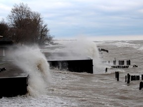 Waves crash into breakwalls behind some properties along Erie Shore Drive in December 2020. File photo/Postmedia