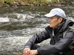 Chatham author Gillian Andrews sits in Algonquin Provincial Park, one of the settings of her new book, The Gift of the Loon. Handout/Postmedia Network
