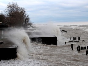 Waves crash into breakwalls behind some properties along Erie Shore Drive on Saturday. A flood warning was issued for area by the Lower Thames Valley Conservation Authority on Saturday. PHOTO Ellwood Shreve/Chatham Daily News/Postmedia
