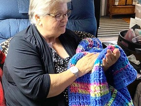 ONE CARE client receives hand crocheted blanket made and donated by the Crochet Club of London through Gift of Care campaign. Submitted