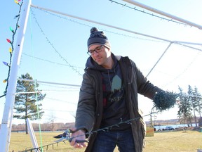 Volunteer Kevin Lajoie doing some lighting work at Holiday Sparkle in Lamoureux Park. Photo on Sunday, December 12, 2021, in Cornwall, Ont. Todd Hambleton/Cornwall Standard-Freeholder/Postmedia Network