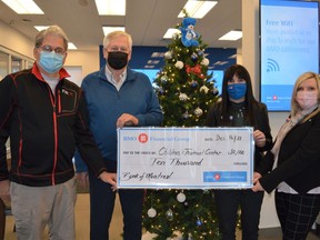 From left to right: chairperson of the CTC's Bike-A-Thon Plus Peter Asquini, CTC president Don Fairweather, local BMO branch manager Cindy Peach, and BMO regional vice president Frederica Jones, with a $10,000 donation from BMO to the CTC on Thursday December 16, 2021 in Cornwall, Ont. Shawna O'Neill/Cornwall Standard-Freeholder/Postmedia Network