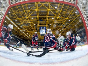 Cornwall Colts Zack Speck-Meek, left, goaltender Dax Easter, and Wil McKinley looking at the puck heading towards the goal line during play against the Hawkesbury Hawks on Sunday, December 12, 2021, in Cornwall, Ont. The Colts lost 3-2. Robert Lefebvre/Special to the Cornwall Standard-Freeholder/Postmedia Network