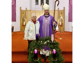 Glenna Mackenzie (left) of Our Lady of Sorrows Parish, Petawawa, has been awarded the Benemerenti Medal by Pope Francis for her outstanding service to the Roman Catholic Church. Most Reverend Guy Desrochers, Bishop of Pembroke, presented the medal to Mackenzie on Dec. 4 at the parish mass for the Second Sunday of Advent.