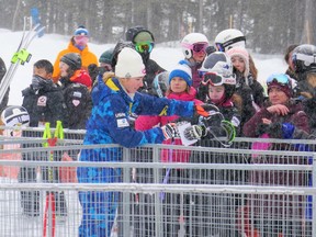 American alpine superstar Mikaela Shiffrin interacts with young ski racing fans following her run Saturday at the Lake Louise Audi FIS Ski World Cup. Patrick Gibson/Postmedia Network