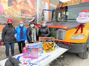 Activettes volunteers Brenda, Val, Sue and Leona spent a cold December 11 outdoors helping ‘Stuff-a-Bus’ with donations from generous Cochranites. Patrick Gibson/Cochrane Times