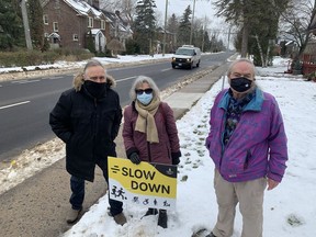 Johnson Street area residents, from left, Rob Fonger, Karin Lavin and David Andrews are among those calling for the city to improve traffic safety along the roadway on Friday.