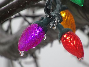 Ice covers Christmas lights as light freezing rain fell across the Kingston area on the weekend making travel tricky in Kingston, Ont. on Saturday, Dec. 25, 2021. 
Elliot Ferguson/The Whig-Standard/Postmedia Network