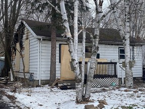 A house on Ford Street in Kingston's north end, seen Wednesday, suffered an estimated $250,000 damage in an overnight Tuesday fire. No one was home at the time of the fire, but a dog was found deceased inside the structure.
