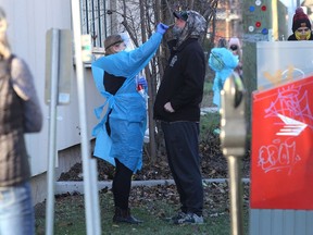 Staff from Kingston, Frontenac and Lennox and Addington Public Health set up a pop up COVID-19 vaccine and testing clinic on Bagot Street just outside of the Artillery Park Aquatic Centre in Kingston on December 13, 2021. The City of Kingston provided two electric busses for the clinic. Ian MacAlpine/The Kingston Whig-Standard/Postmedia Network