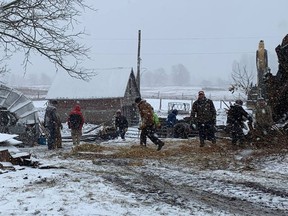 Family, friends and neighbours pitch in to help with clean-up of the barn/stable at Swiftwind Equine Centre in Lyndhurst after the windstorm of December 11/12.  Supplied by Swiftwind Equine Centre