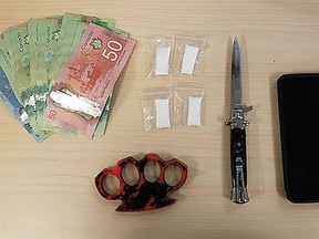 Kingston Police display items seized from a suspect on Dec. 7.