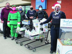 The third annual Stuff a Cruiser event collected food and cash for the Leduc & District Food Bank at three locations last Saturday, including the Leduc Safeway. (Ted Murphy)
