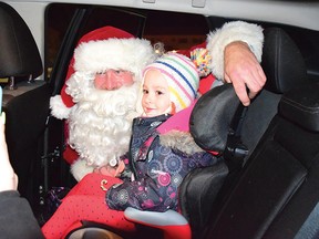 Photo by KEVIN McSHEFFREY/THE STANDARD
This child got a close-up visit from Santa while in the back of his parents’ vehicle during the Elliot Lake Santa Claus Parade on Friday evening. Santa Claus was stationed at the Elliot Lake city hall during the community’s second static Santa Claus parade. The first was in November 2020. For more, see page 5.