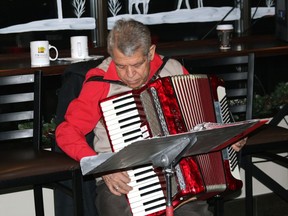 Carmine Riciutti entertains customers and radio listeners in 2021 at Twigg's Coffee Roasters on Fraser Street in the annual fundraiser for the North Bay Santa Fund. He will return to the coffee shop this year to help the North Bay Santa Fund.
PJ Wilson/The Nugget