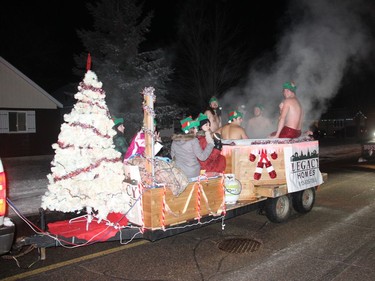 A hot tub is one way to keep warm on a cold winter's night as evidenced by the Legacy Homes entry in Petawawa's Santa Claus parade held on Dec. 4. Anthony Dixon
