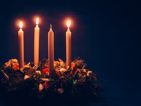 An advent wreath with three candles lit marking the third Sunday in Advent leading up to Christmas. Katarina Gondova Getty Images