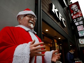 A Colonel Sanders statue is dressed as Santa Claus at a KFC restaurant in Tokyo. Kim Kyung-Hoon/Reuters