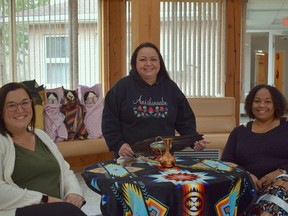 Kyleigh Alexander (left), Tania McCormick (middle) and Fatima Taylor are the three women behind the foster care program, called Alternative Care, at Mnaasged Child and Family Services in Munsee-Delaware First Nation. The Indigenous child wellbeing agency is now recruiting Indigenous and non-Indigenous foster parents across Southwestern Ontario to apply. Calvi Leon/Postmedia